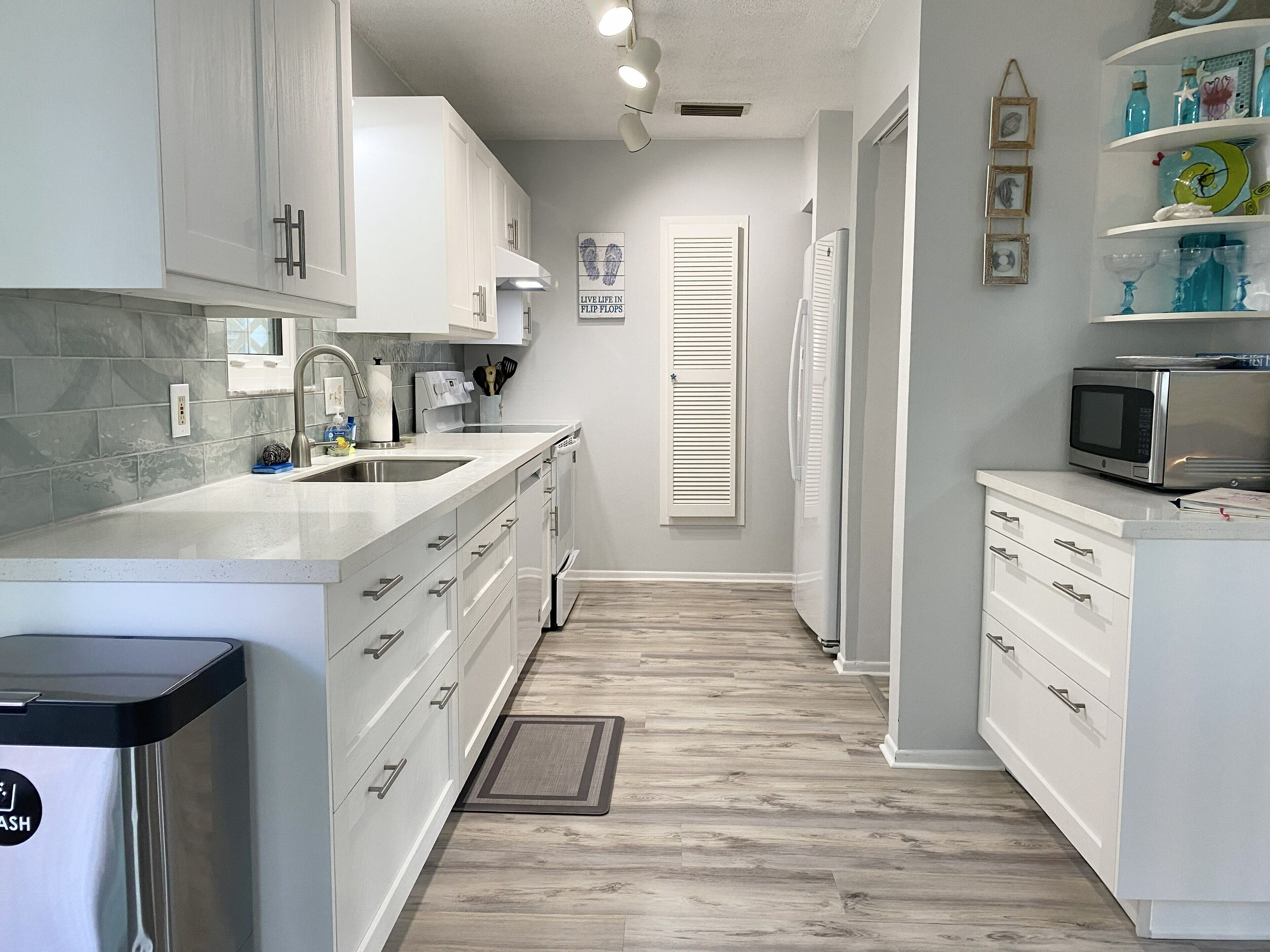 Clean up is a breeze with large sink, dishwasher and even the high capacity washer and dryer in the garage below! 
