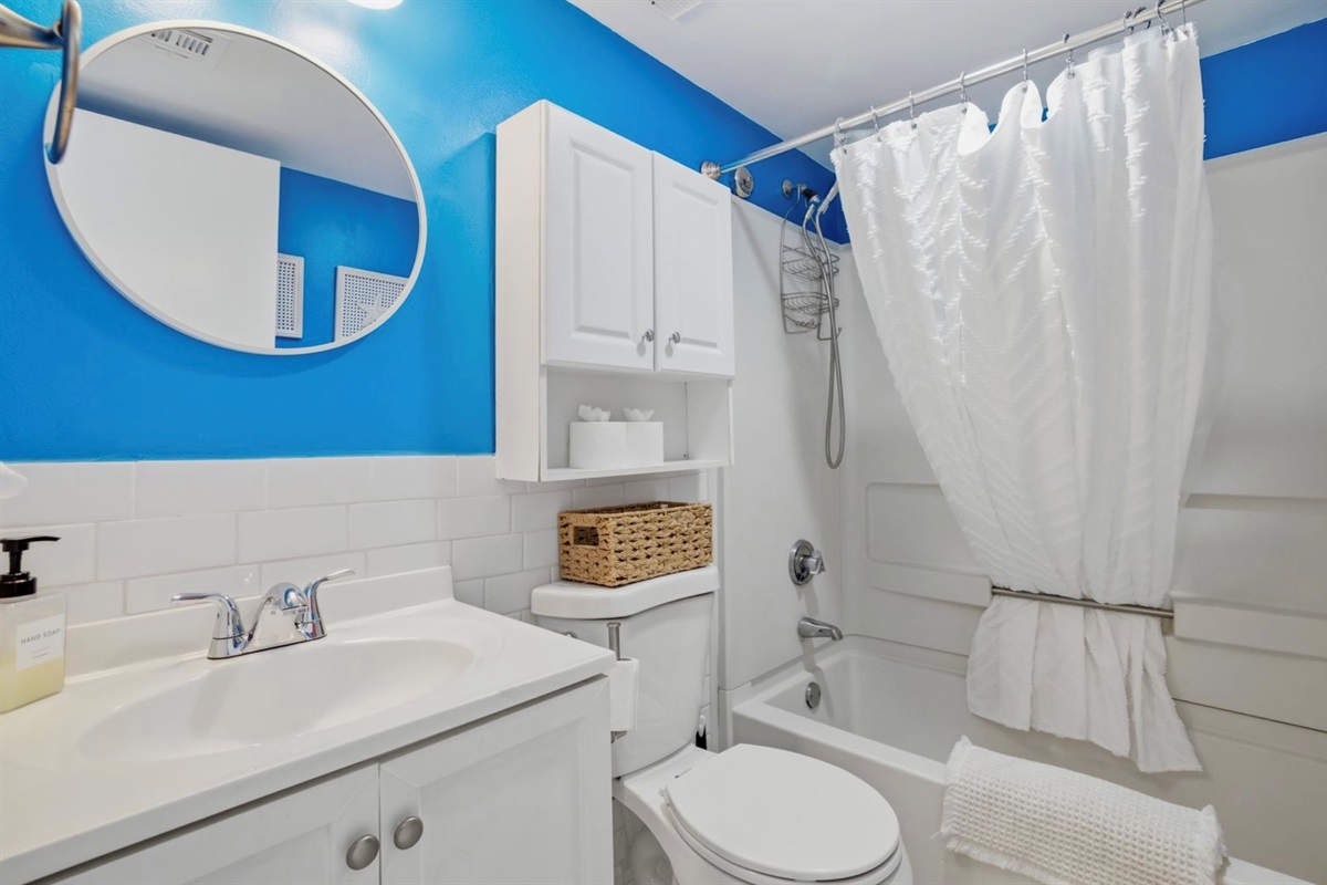 A fresh, clean bathroom with calm coastal accents and soft styling — soothing, simple, and intentionally designed for a relaxed, elevated stay. ⭐