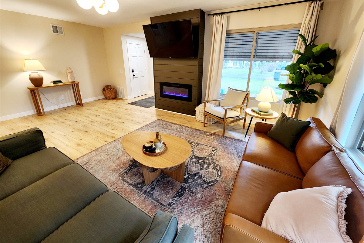 Relax and enjoy tv or a warm fireplace on one of two couches.