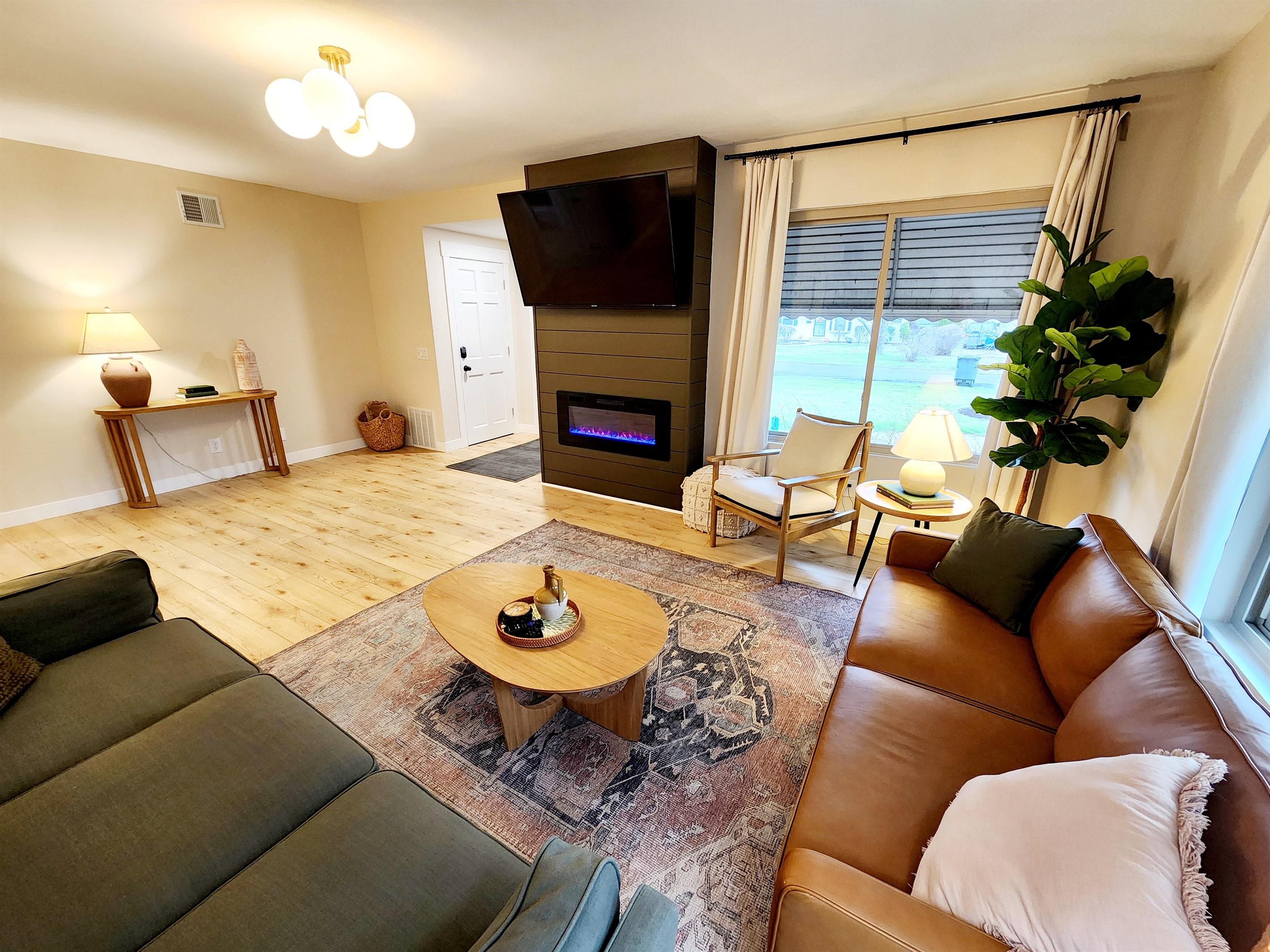Relax and enjoy tv or a warm fireplace on one of two couches.