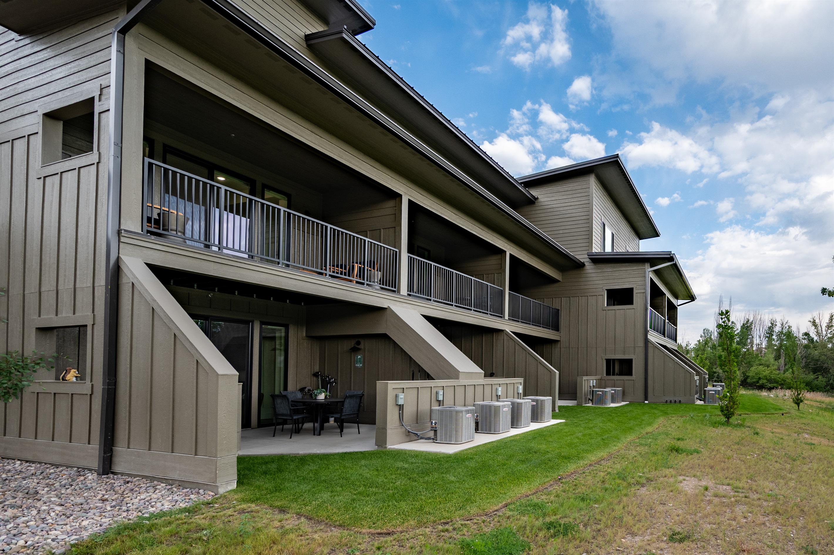Sleek architecture with private balconies and large windows designed to showcase the views.