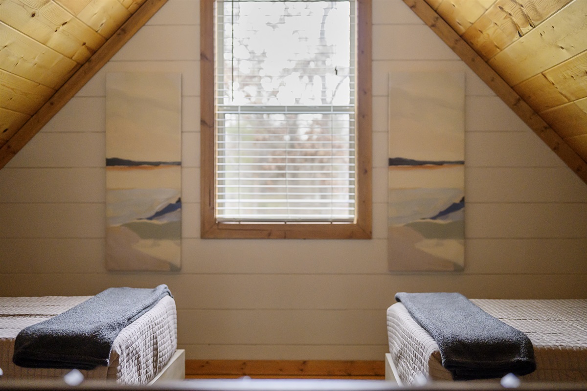 Embrace the tranquility of the outdoors from the charming window in our attic - where every view is a breath of fresh air