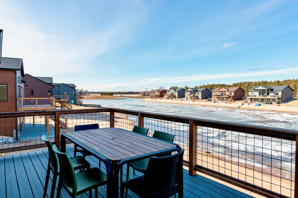 Outdoor seating on upper balcony overlooking the man made lake.
