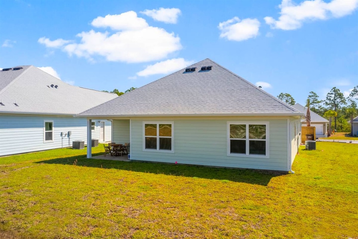 Well-designed home exterior with a comfortable backyard setting
