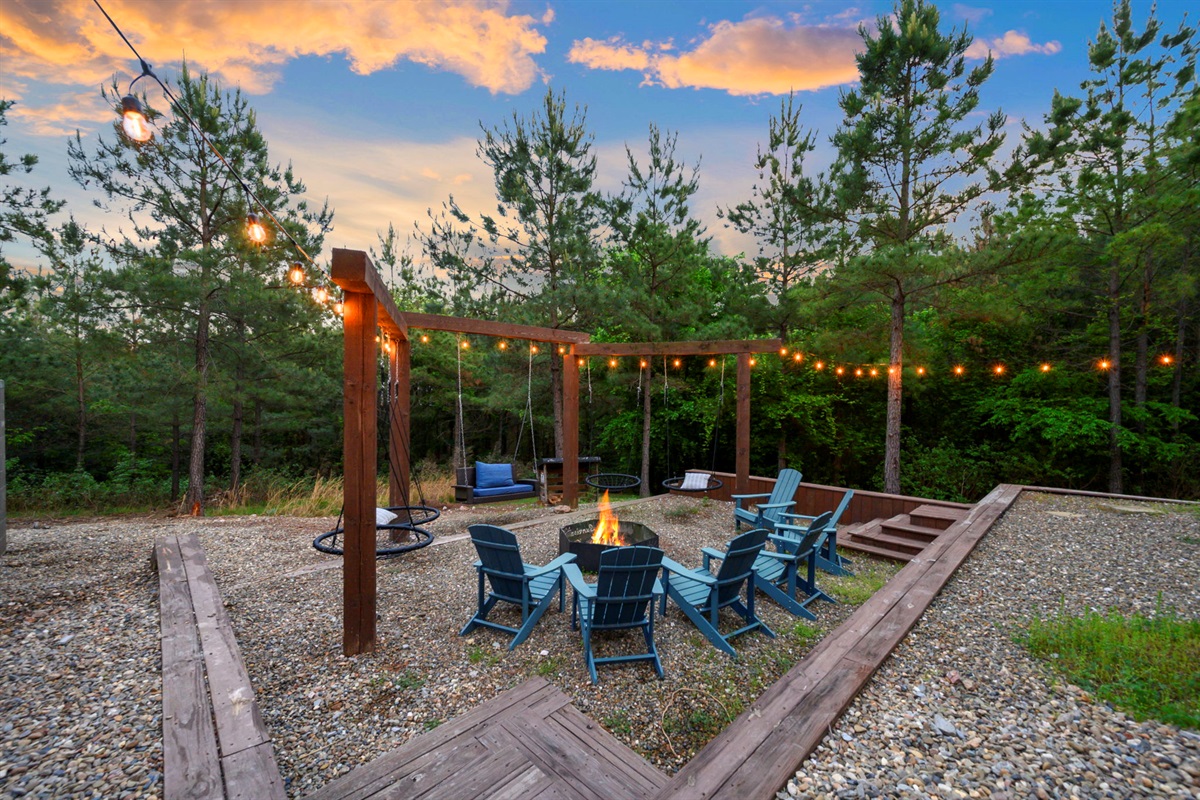 Backyard oasis with string lights, fire pit, and cozy seating—perfect for s’mores, late-night conversations, and unforgettable evenings.
