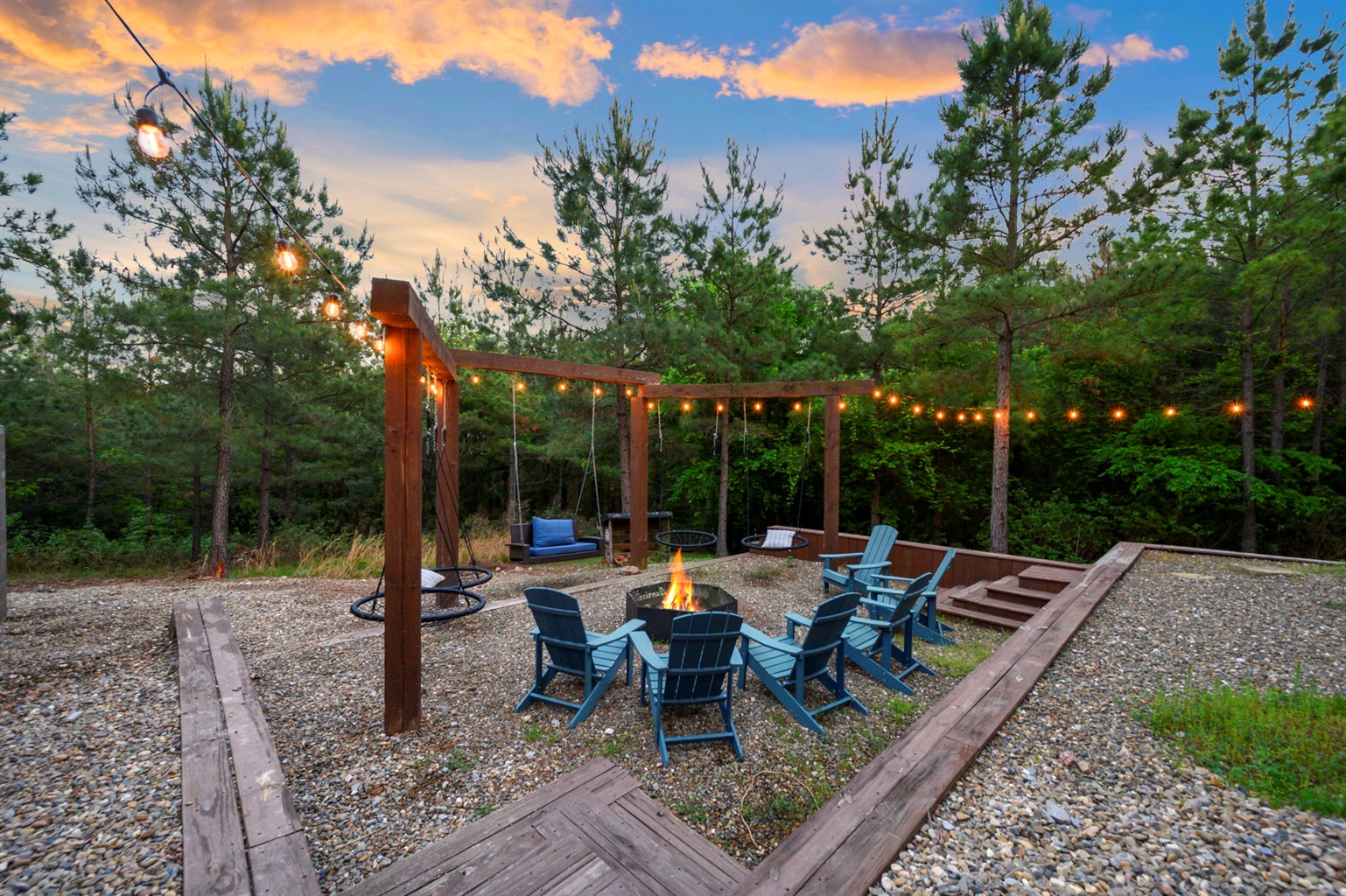 Backyard oasis with string lights, fire pit, and cozy seating—perfect for s’mores, late-night conversations, and unforgettable evenings.