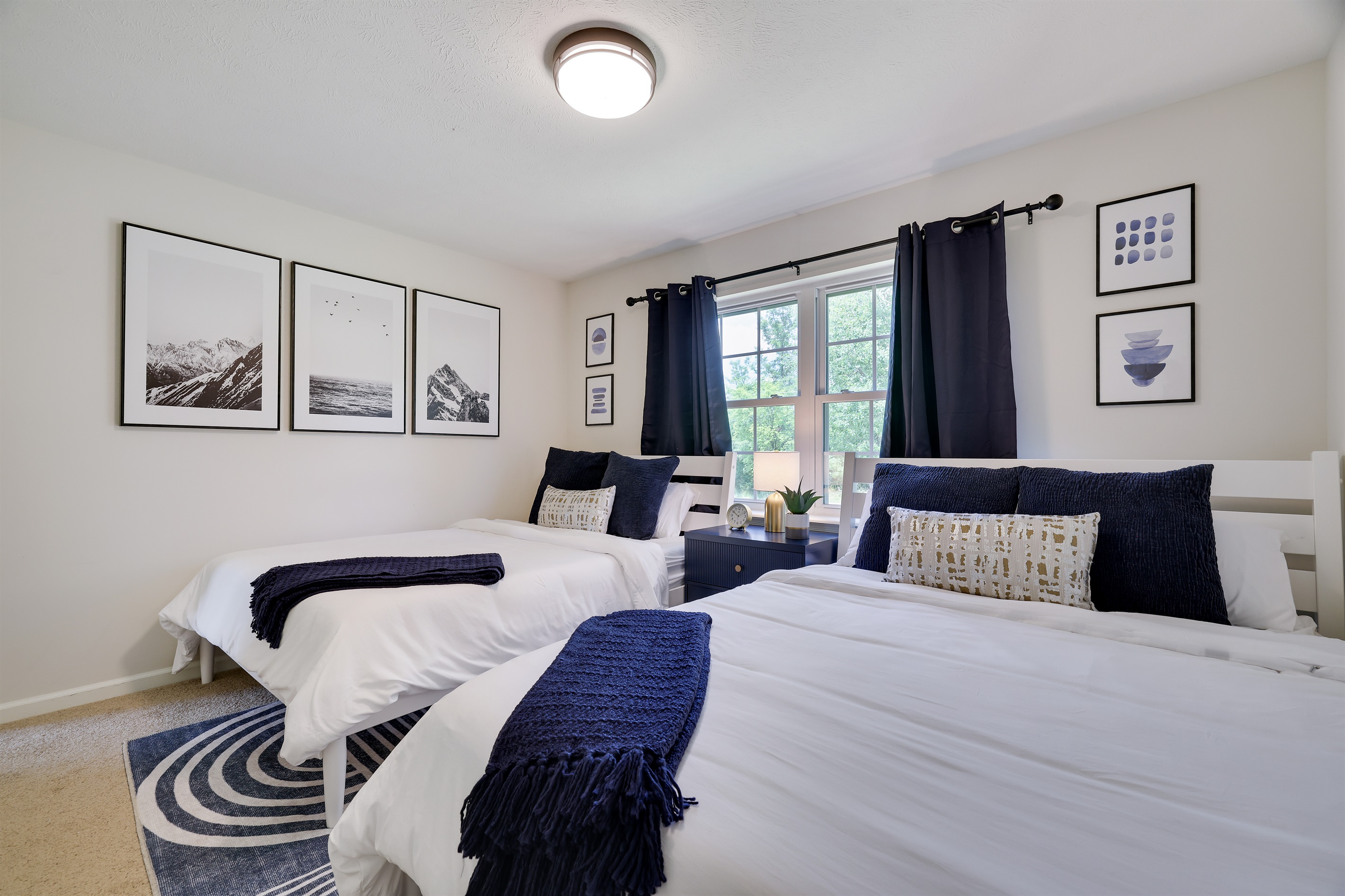 The fun never stops in the bedroom with two queen beds.