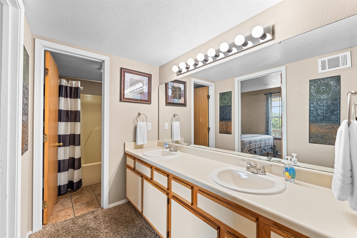 Another look at the main-level vanity area with easy access to bedroom and bath.