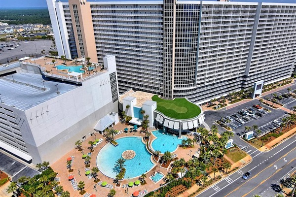 Full resort aerial view- NEW family restaurant coming in 2025- 810 Billiards & Bowling!  Family entertainment next to the pool