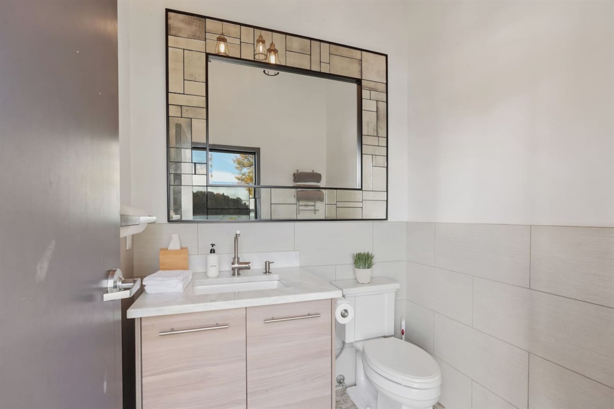 Outdoor bathroom just steps away from the pool located on the patio.