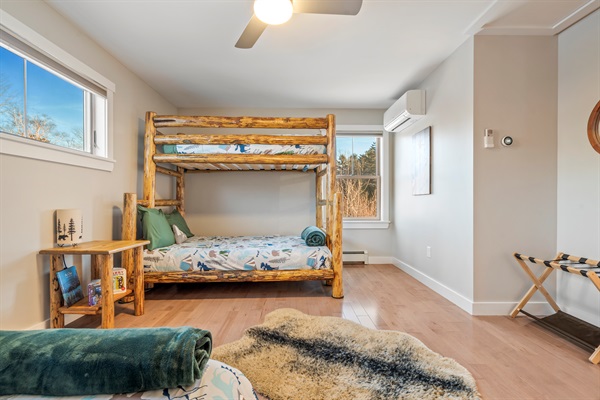 Spacious bedroom for kids or multi-family stays with bunk bed and double bed.