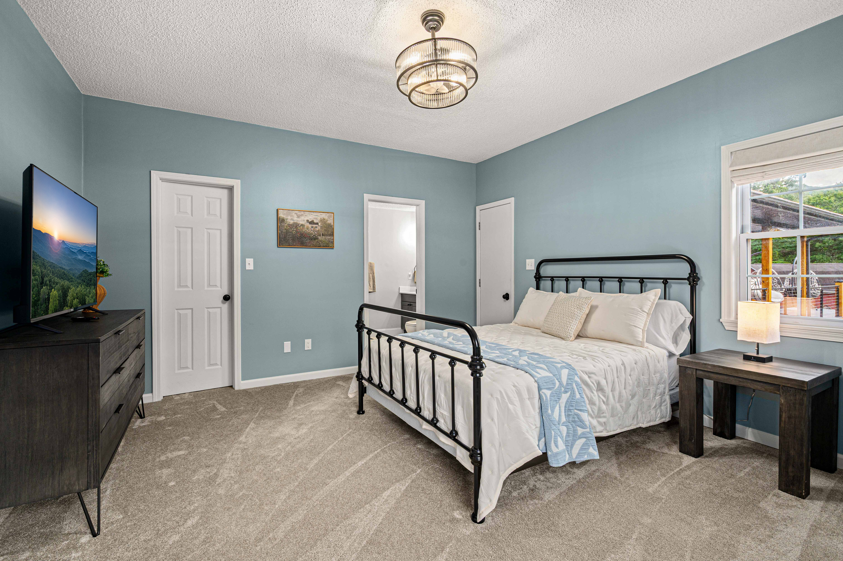 Bedroom Retreat: Relax in this stylish room with mountain views and modern comforts!