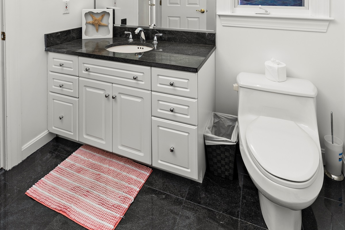 Modern ensuite with a spacious standing shower for your retreat.