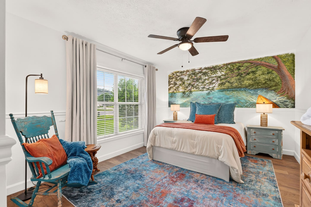 Welcome to our Rainbow River Room.  With bright colors and another amazing mural, this room will not disappoint!  A comfortable queen bed with extra pillows for a comfortable nights sleep dreaming about the adventures that await!