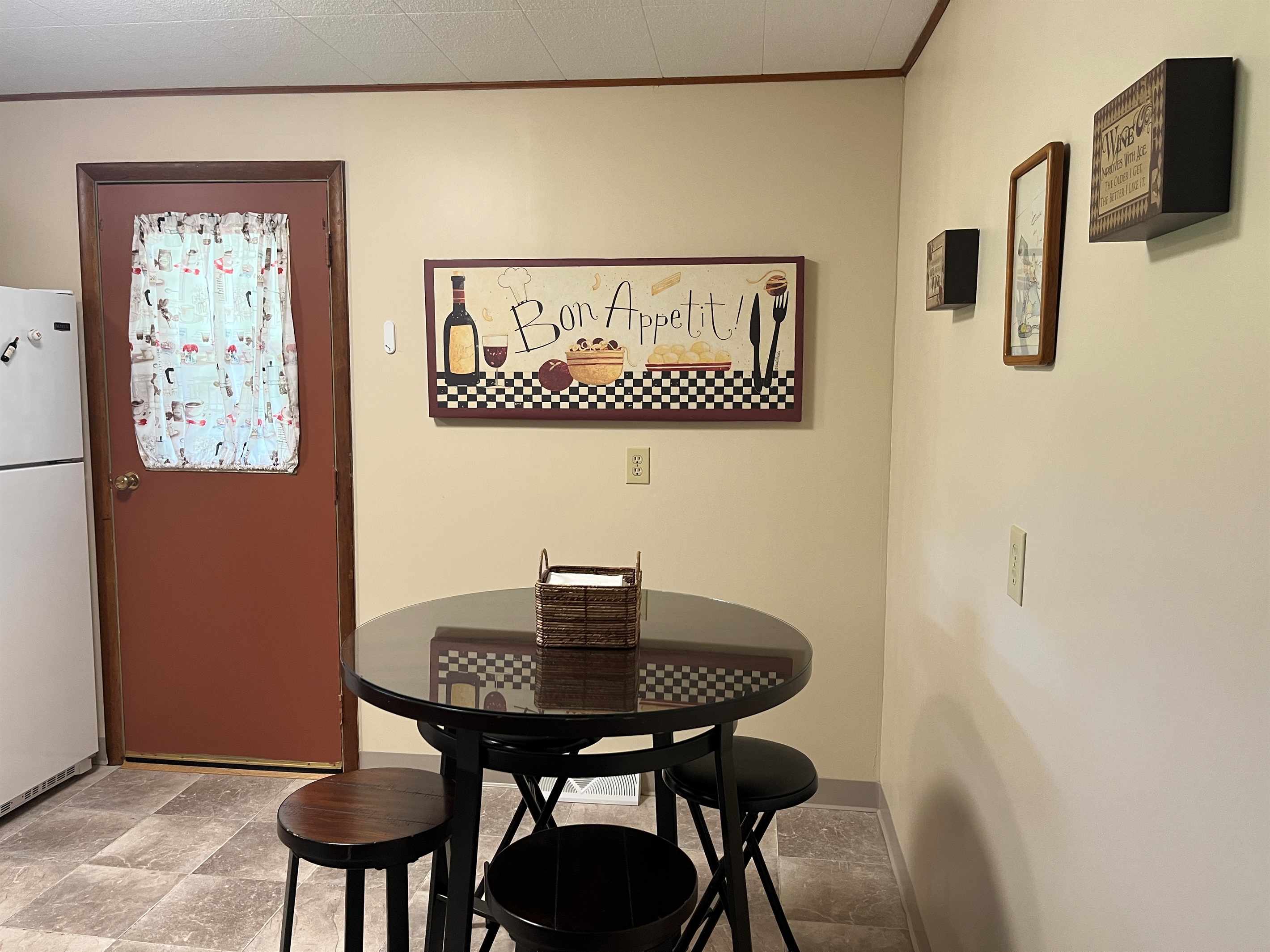 Eat-in kitchen dining area, with side door to balcony