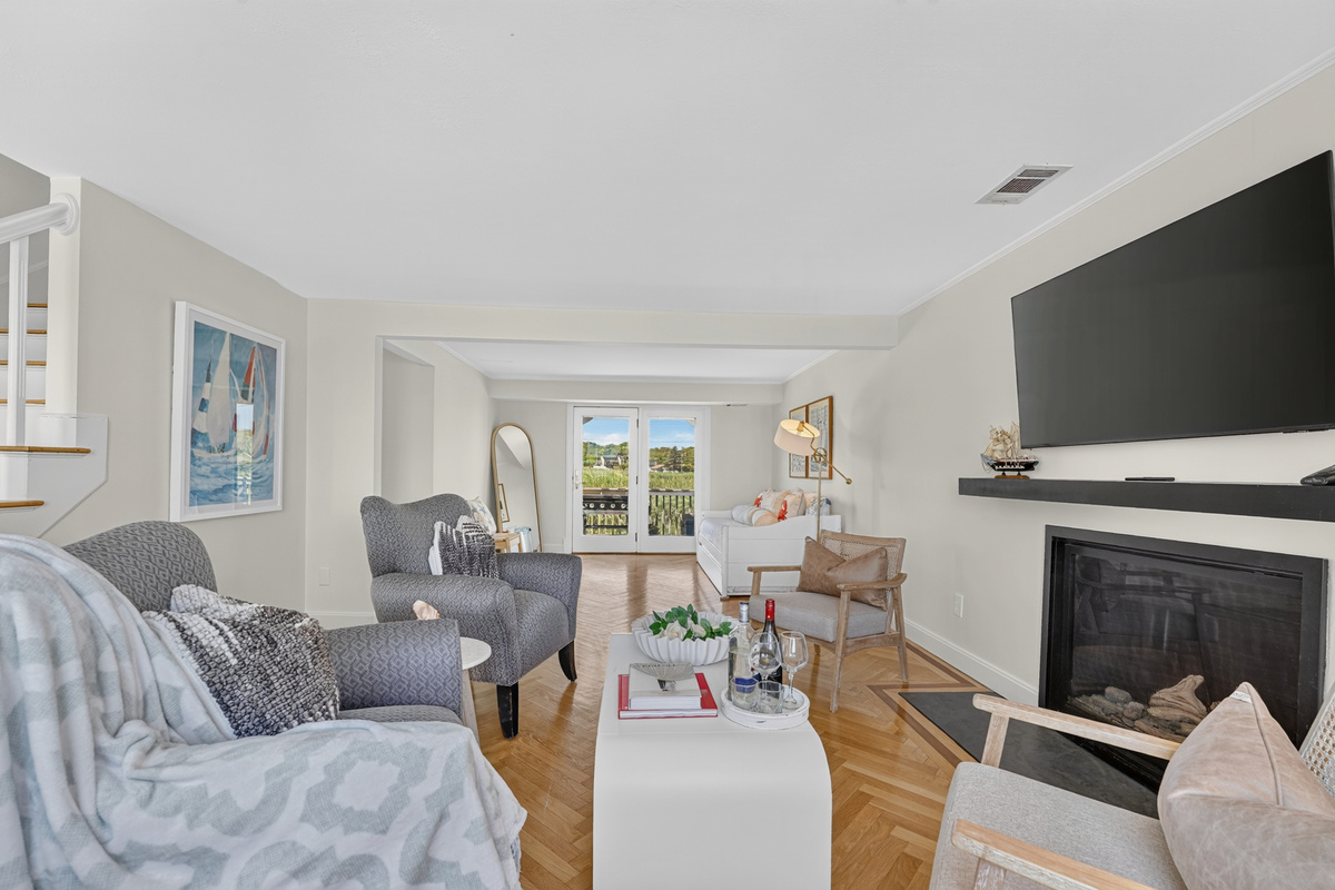 Relax by the fireplace while enjoying the bright, open living space and breathtaking coastal scenery.
