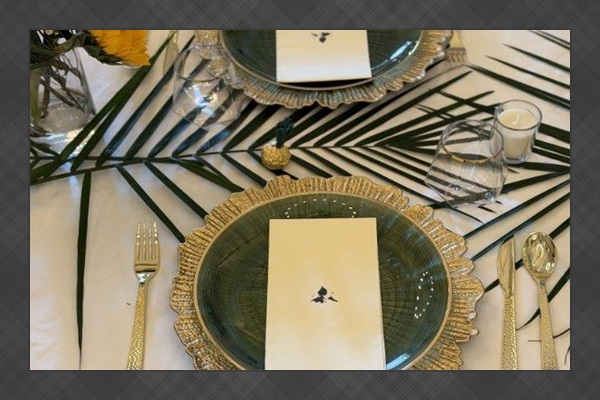 Tables, chairs, multiple pieces of place setting provided