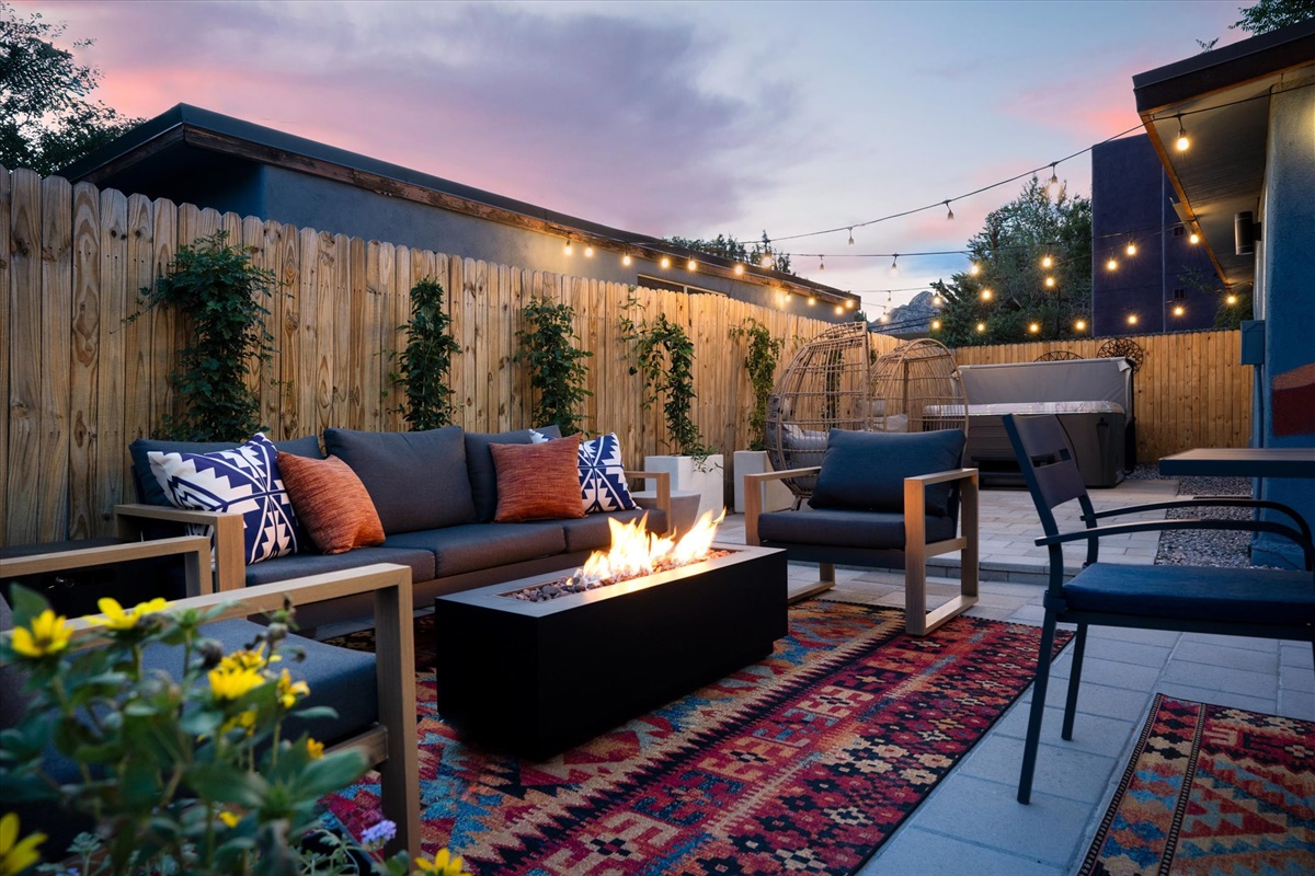 As the sun sets, this backyard oasis transforms into the ultimate gathering spot for good times and relaxation.