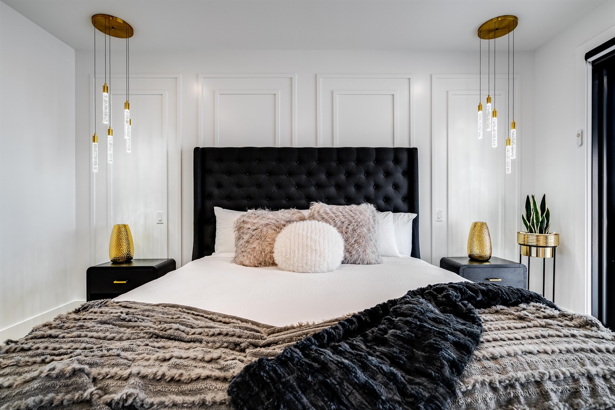 King Bedroom with Sleek nightstands with modern lamps provide functional style.