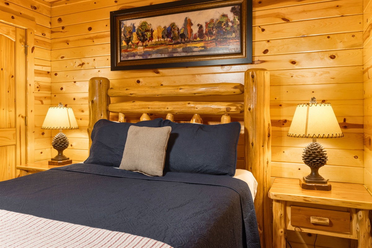 Bedroom 1 alternate view with cozy wood details.