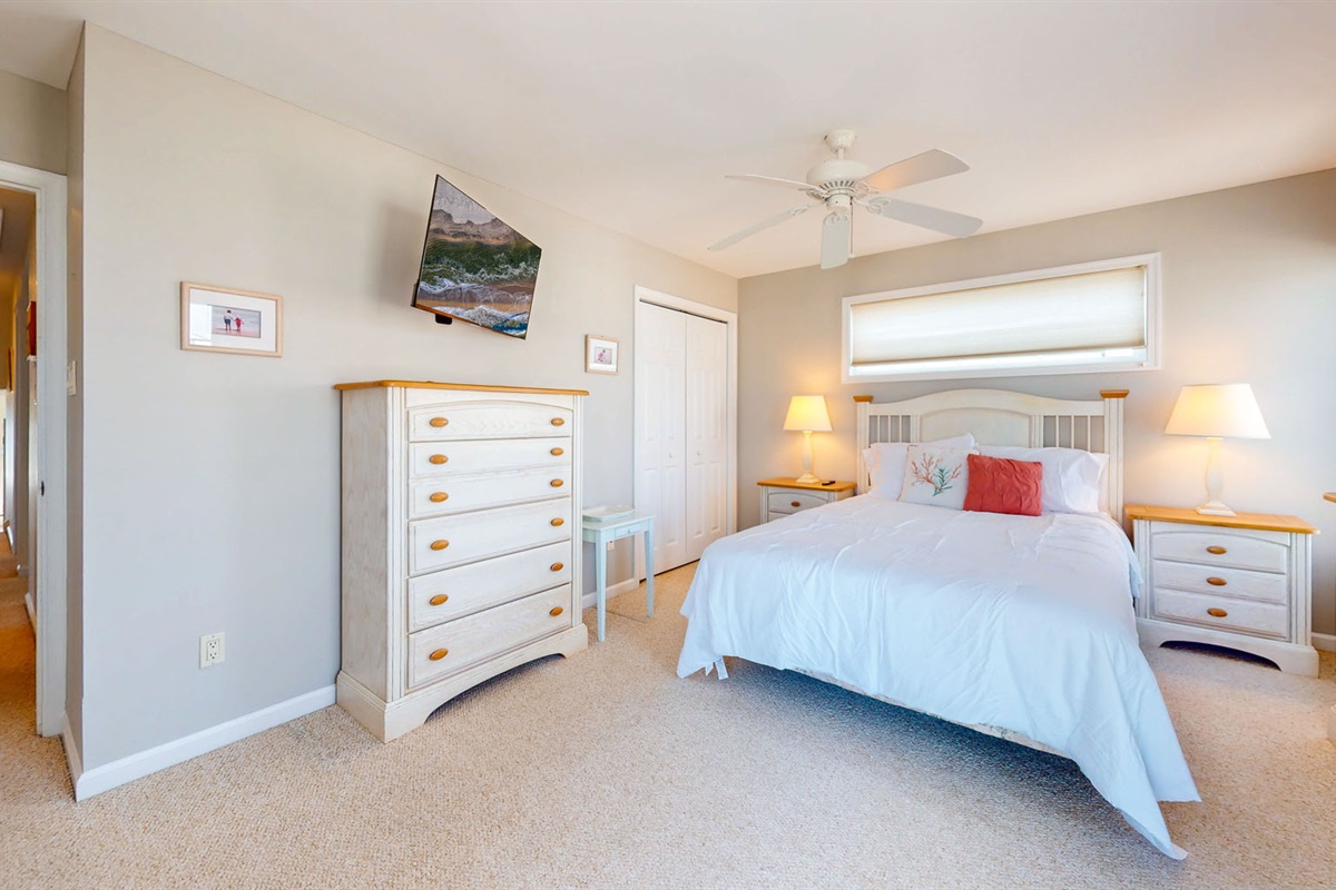 Queen sized bed with a beautiful dresser 