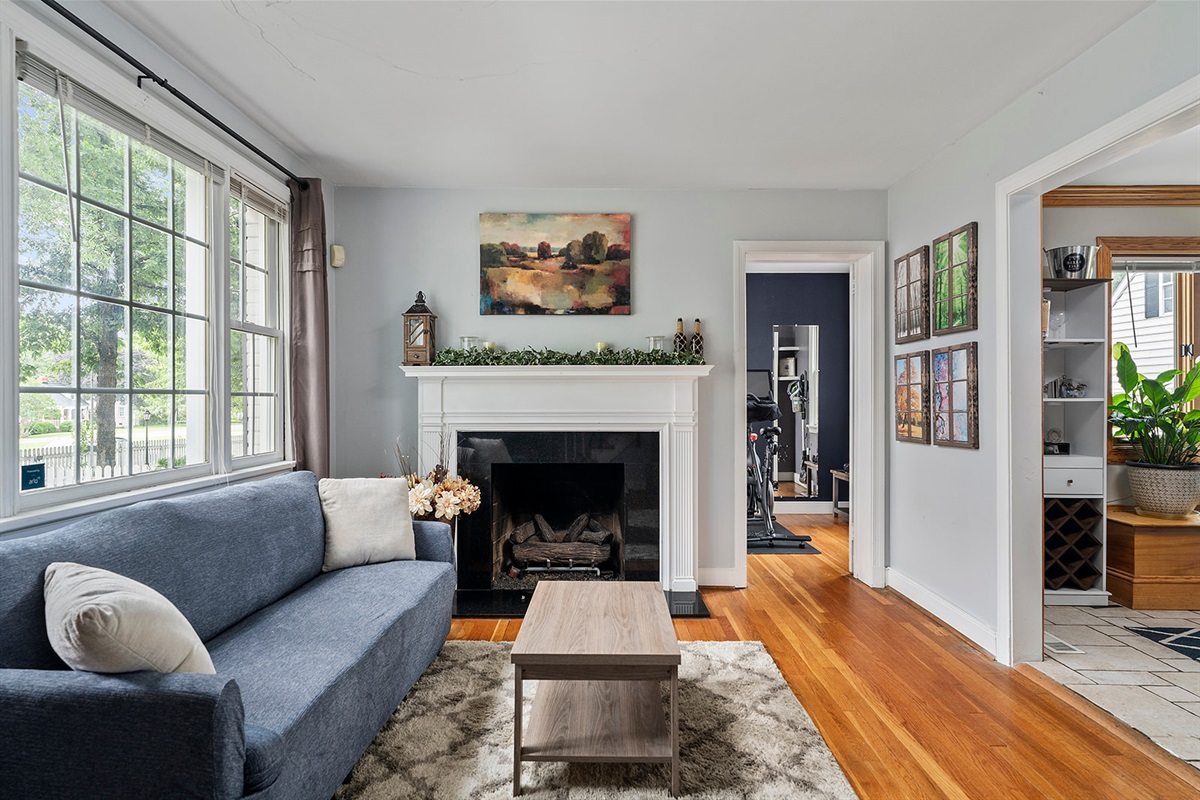 Foyer: Bright and inviting space with plush seating and a charming fireplace!