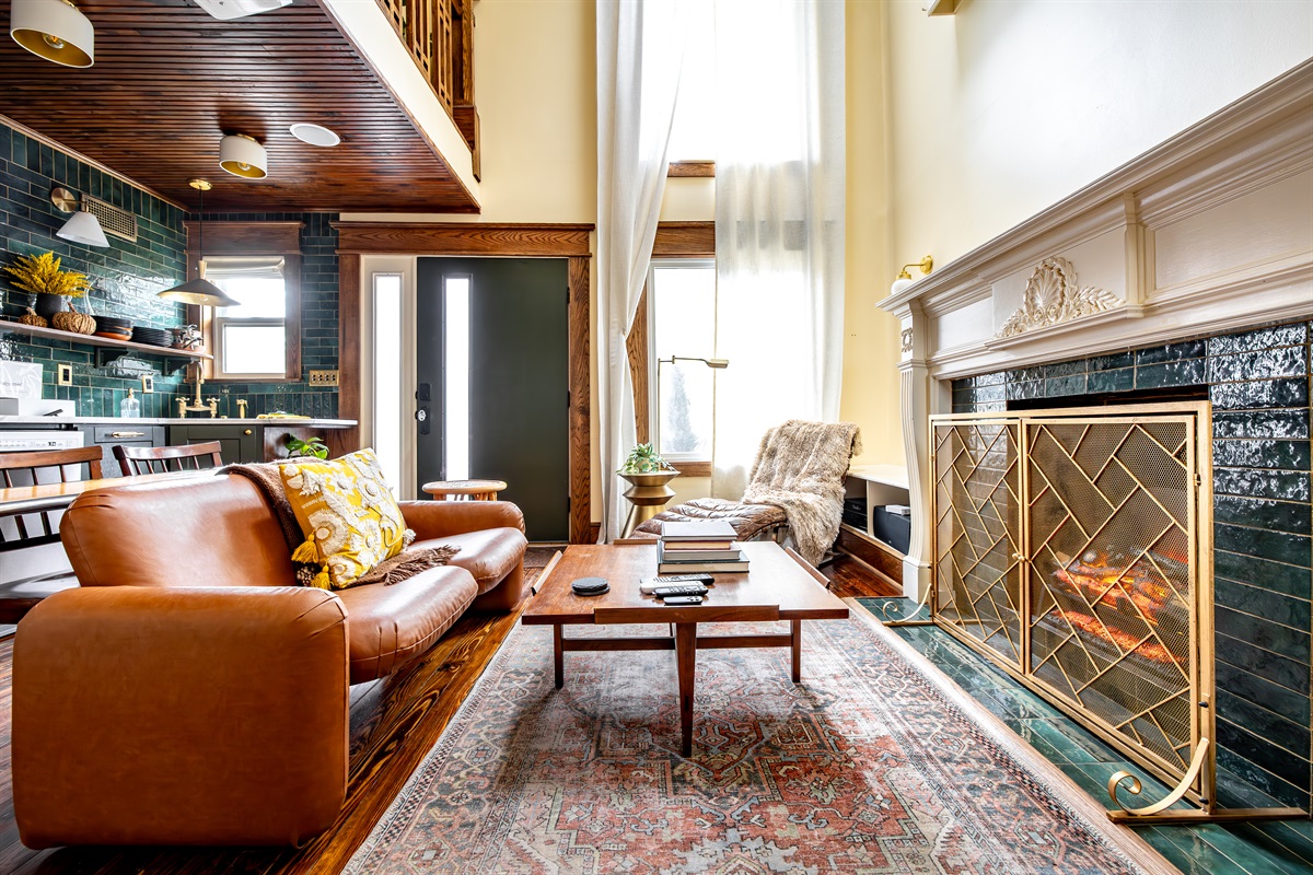 Relax by the electric fireplace that can even make fire sounds. Either the Herman Miller chiclet sofa or the Restoration Hardware lounge make a great spot for chilling.