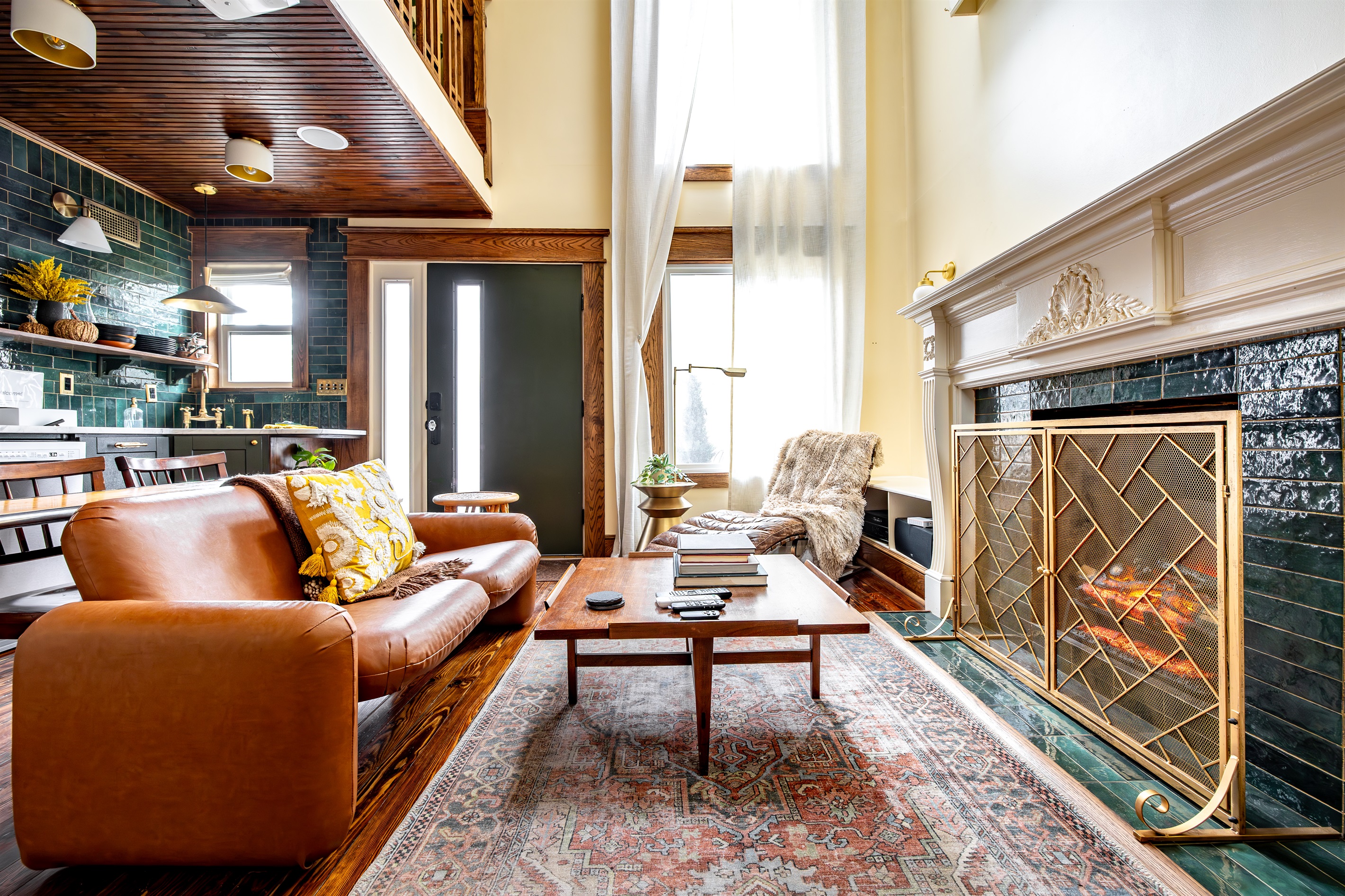 Relax by the electric fireplace that can even make fire sounds. Either the Herman Miller chiclet sofa or the Restoration Hardware lounge make a great spot for chilling.