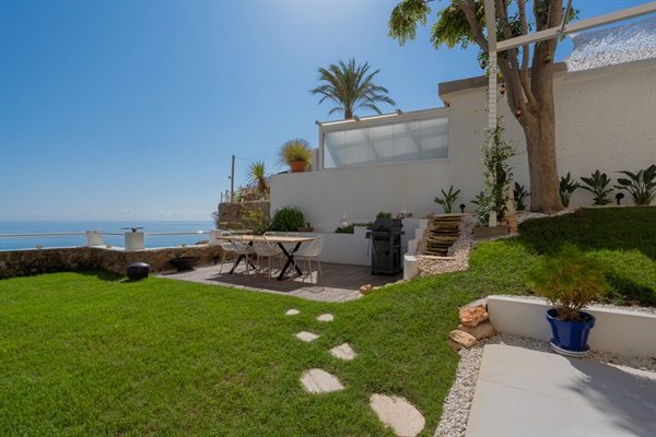 Dine al fresco in Casa Folimanka's outdoor private dining area. Under the vast blue sky, enjoy the sea view, lush greenery, and the sizzle of the BBQ. An inviting space for memorable meals and moments. #OutdoorDining