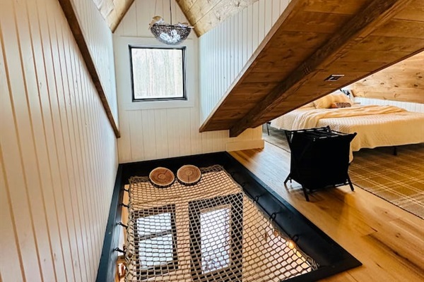 Adding a playful touch, a hammock is ingeniously built into the floor, perfect for lounging and soaking in the serene atmosphere.