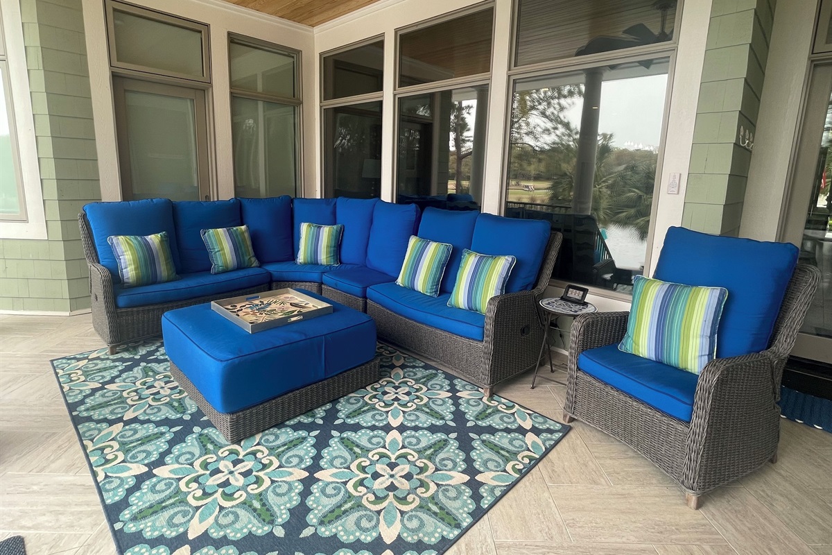 Relax on our rear porch overlooking the pool & back yard.  Plenty of seating!