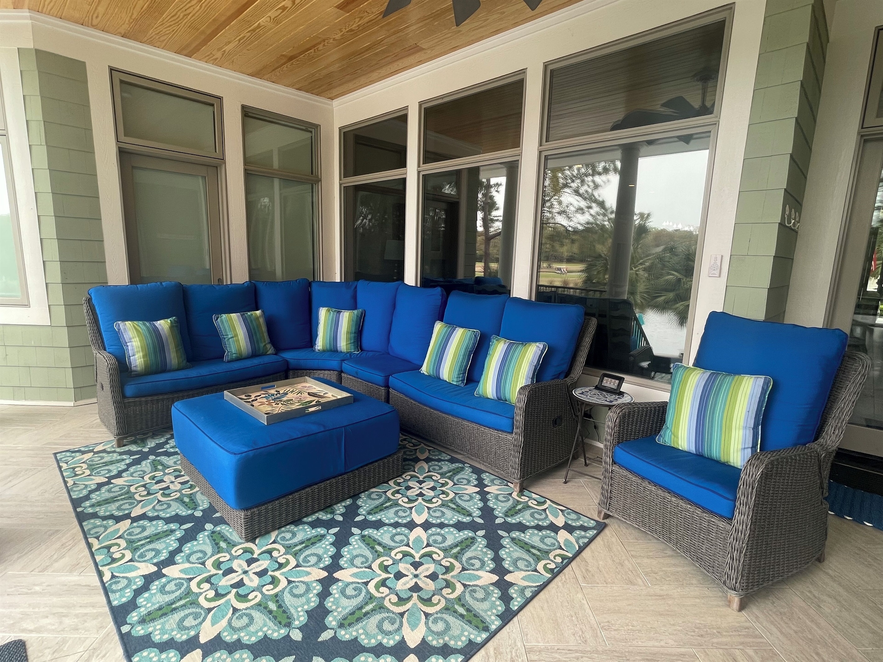 Relax on our rear porch overlooking the pool & back yard.  Plenty of seating!