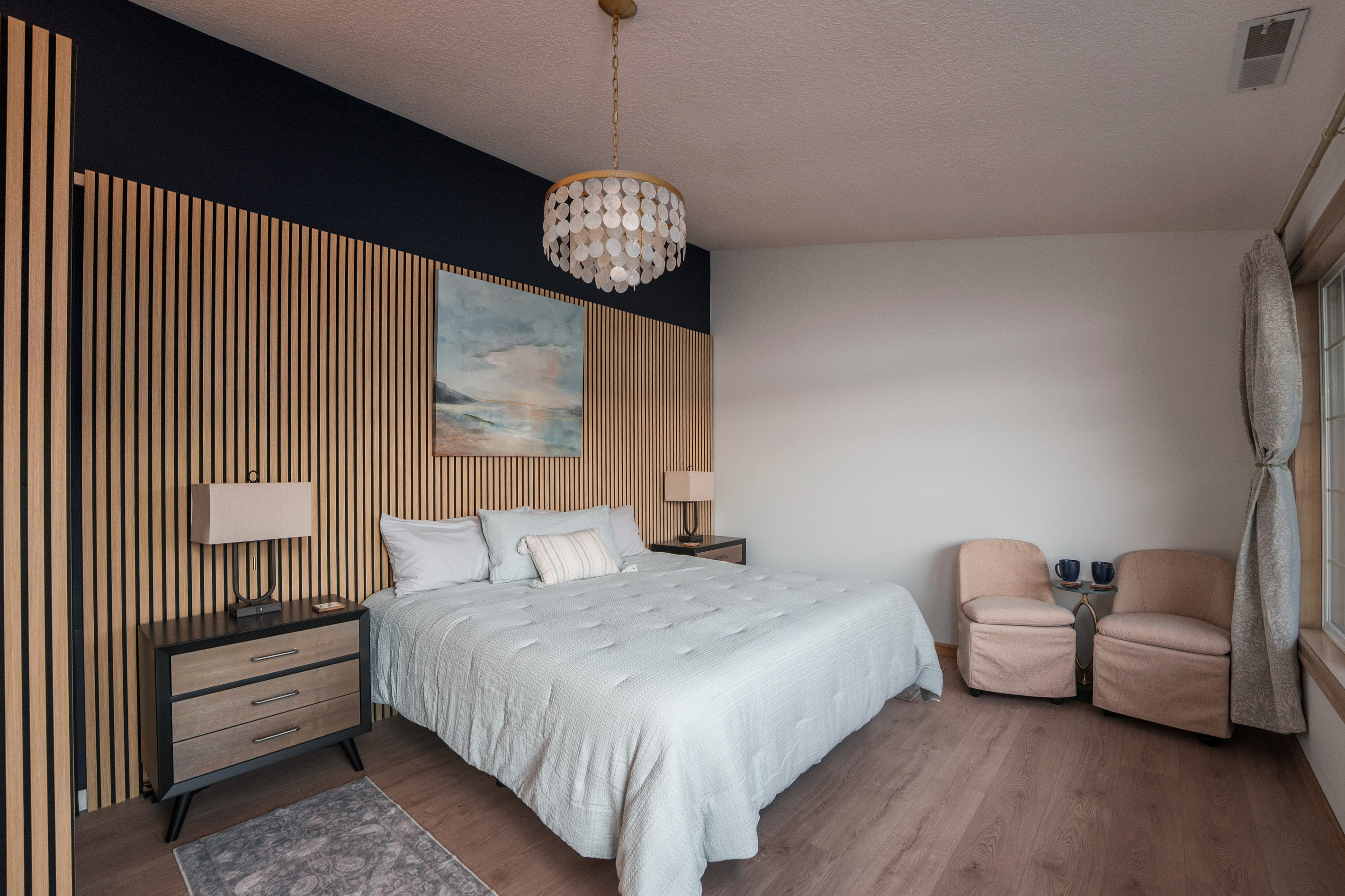Wake to peaceful lake views from this king bedroom for two, complete with an adjoining nursery and convenient access to Bathroom 3, shared with Bedroom 3.
