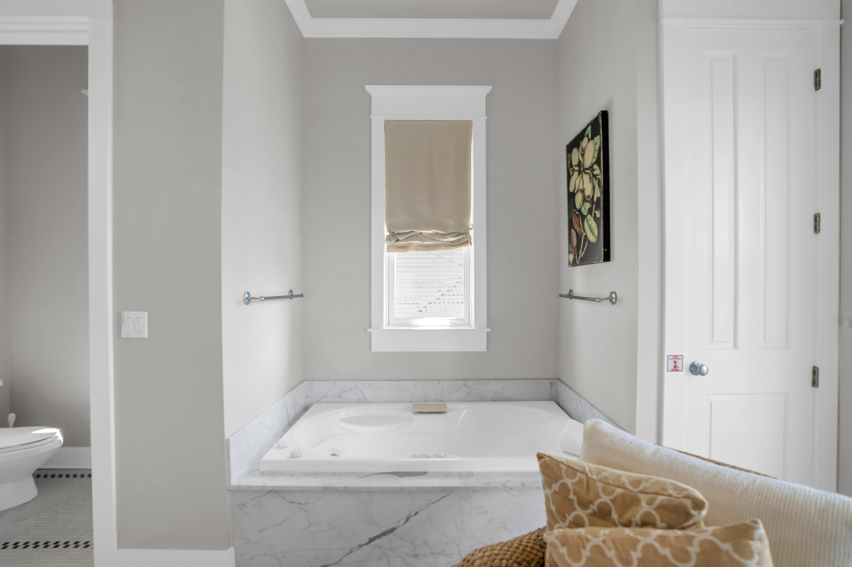 2nd floor king bedroom ensuite bathroom with double vanity, tub and shower.