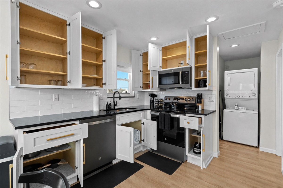 Modern, fully equipped kitchen with ample storage, sleek appliances, and clean finishes—perfect for cooking, meal prep, and easy everyday living.