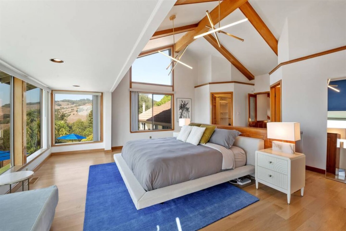 Master bedroom with a king bed, walk-in closet, and ensuite bathroom.