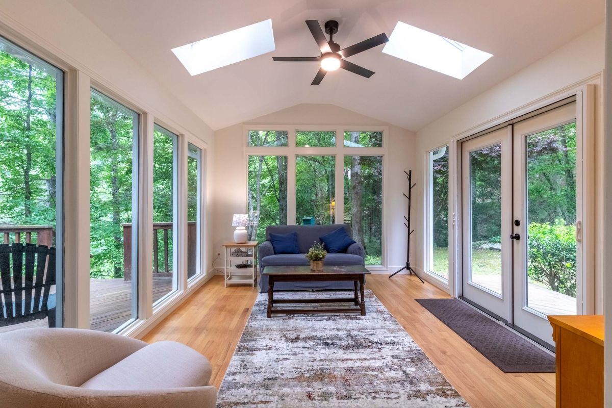 Sunroom Retreat: Experience nature's embrace in this bright space, surrounded by lush greenery!

