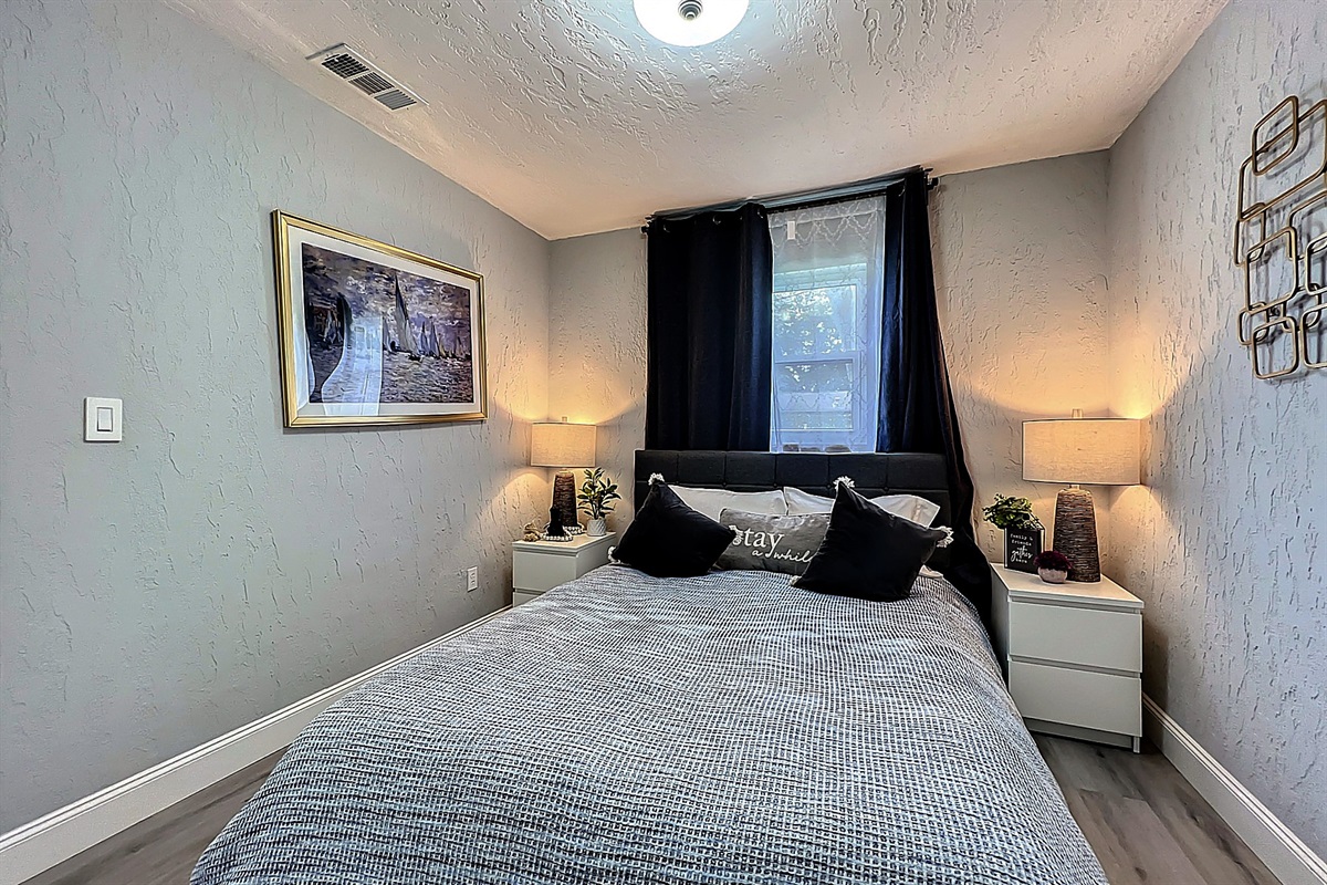Comfortable bedroom featuring king-size bed, elegant furnishings, and serene atmosphere for ultimate relaxation