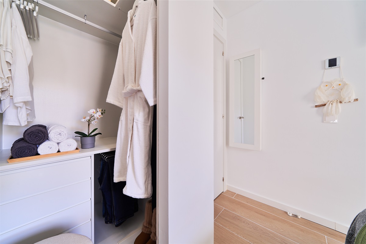 Bright and elegant master bedroom with a private terrace, walk-in wardrobe, and a serene atmosphere designed for restful nights.