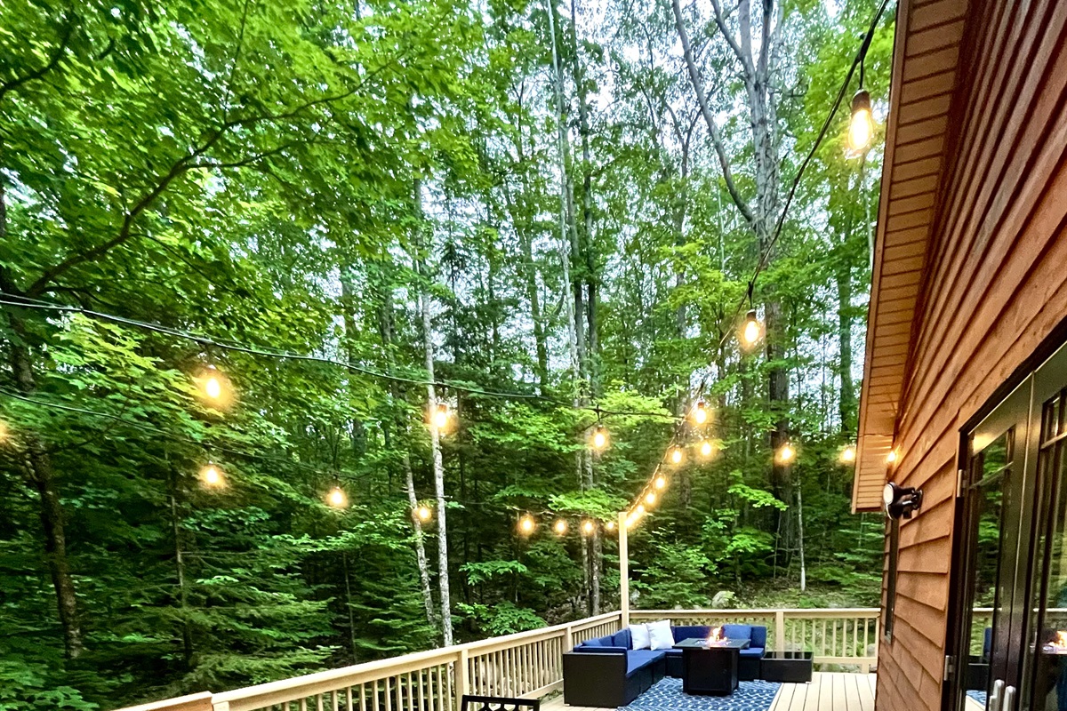 New 2022 feature dining table and lounge chair with propane fireplace string lit. Outdoor amenities seasonal mid May- 3rd week of Oct 