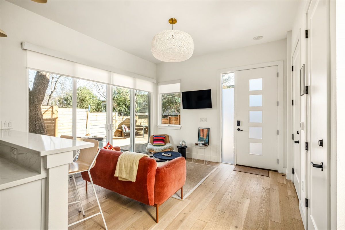 Bright and inviting living room with large windows and plenty of natural light