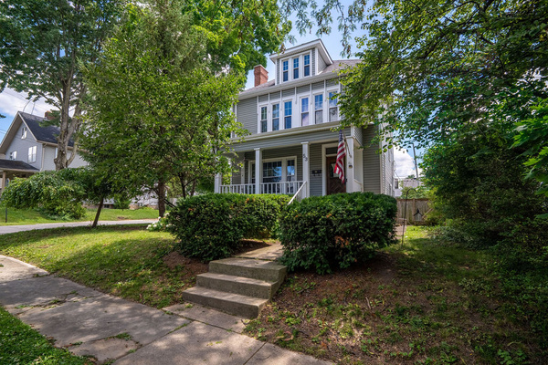 Charming historic curb appeal. Nestled in a quiet, family-friendly neighborhood with plenty of space to unpack and settle in. Plenty of Parking along the front, side of the house (corner lot), and garage port parking make this perfect for large families.