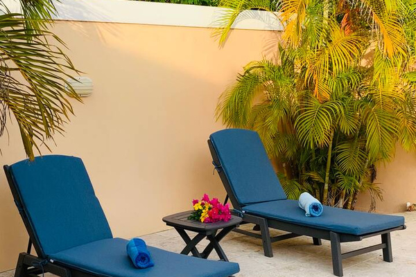 Lounge in the sun while your family enjoys the home's private pool!