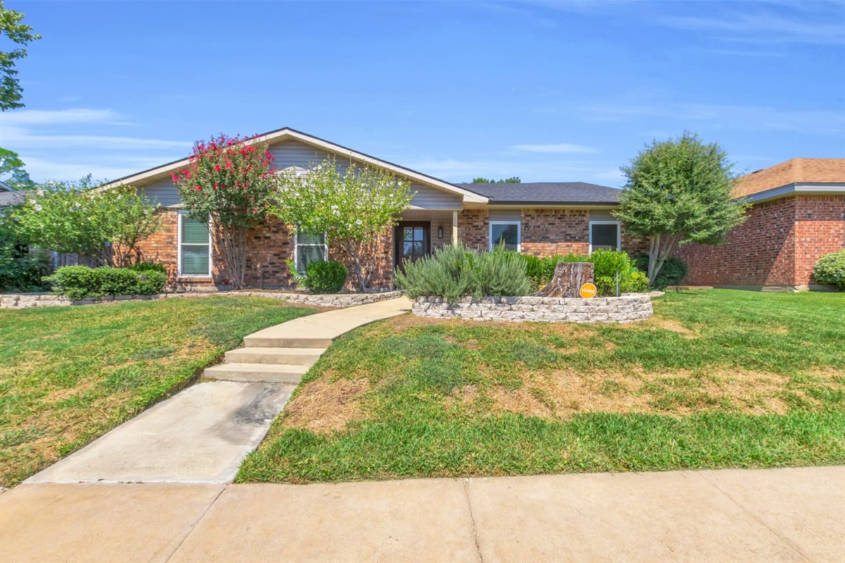 Welcome to your charming Texas retreat! This spacious brick home with a manicured lawn is the perfect escape!