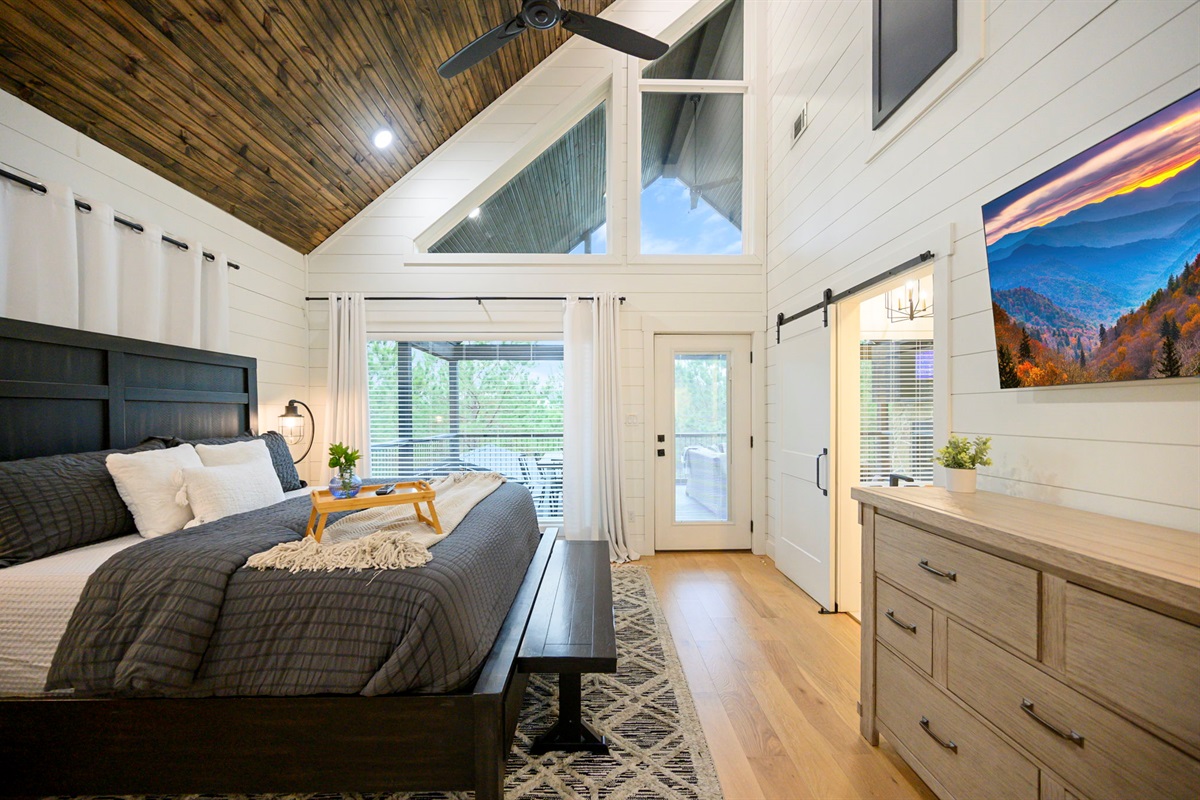 2nd king suite with vaulted ceilings and private deck access.