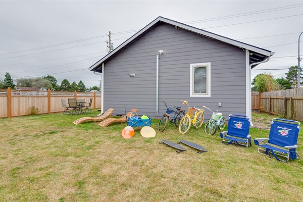 Loads of beach toys including bikes, skim boards, chairs and a wagon to carry.