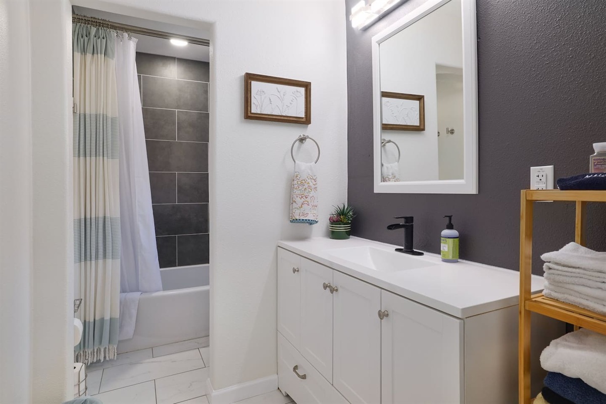 Clean lines, soft lighting, and modern finishes create a fresh, relaxing bathroom space to start and end your day comfortably. Fully stocked with essentials for an easy, stress-free stay.