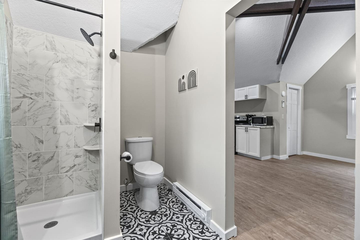 A bathroom featuring unique and fun flooring that adds character and charm to the space.
