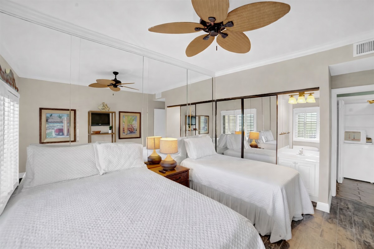 Guest bedroom will accommodate 3 guests. I will be removing the mirror wall, putting a new fan with light kit in, wall mounting a smart tv and a vanity.  