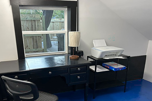 An office with a view, a phone charging station, a printer, printer paper, and high-speed internet.